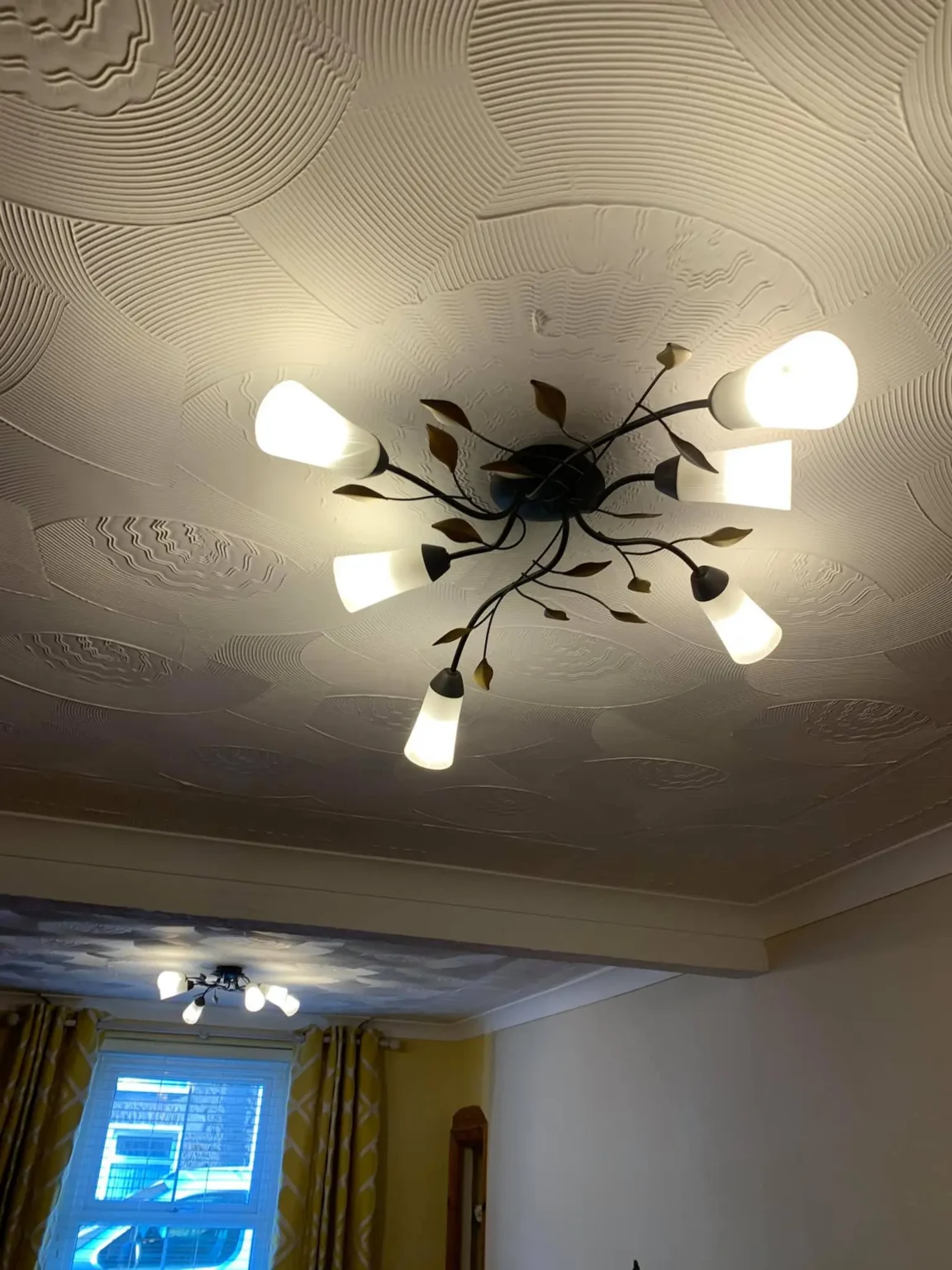 ceiling light installation electrical services swansea - L & W Electrical Ltd Ceiling light fixture with decorative leaf design installed by L&W Electrical Ltd, showcasing reliable Electrical Services in Swansea.