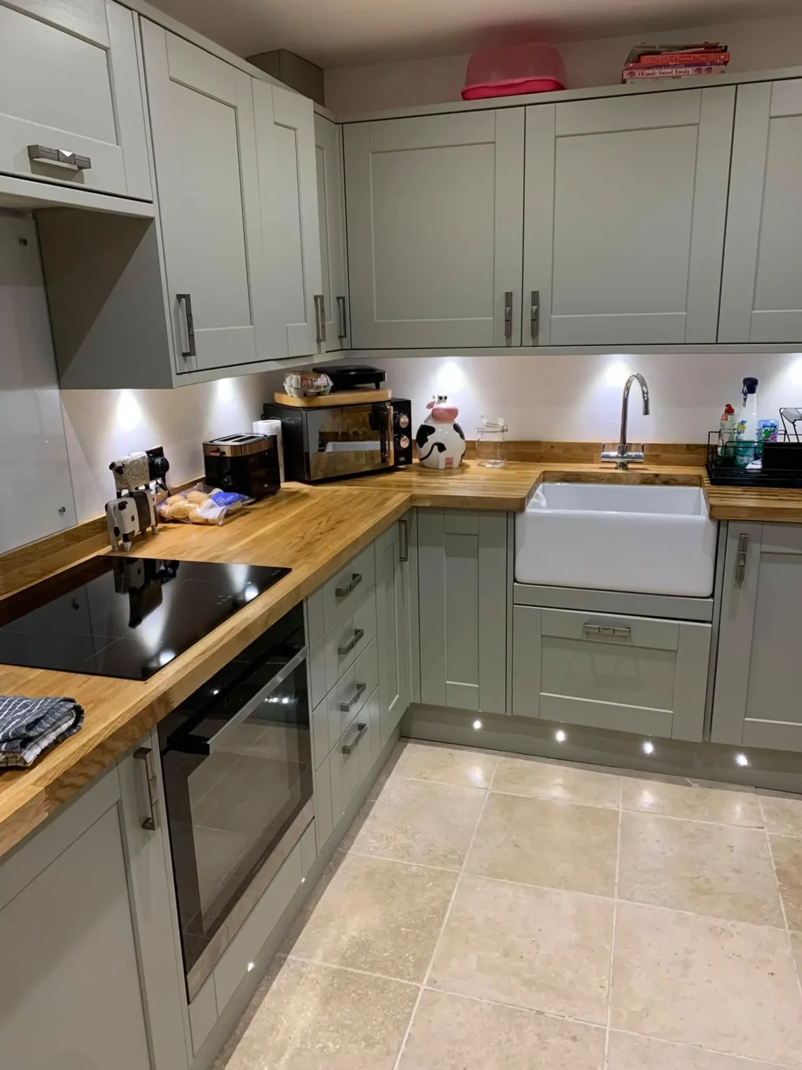 modern kitchen electrical services swansea - L & W Electrical Ltd Modern kitchen with under-cabinet lighting and electrical fixtures by L&W Electrical Ltd, showcasing professional Electrical Services in Swansea.